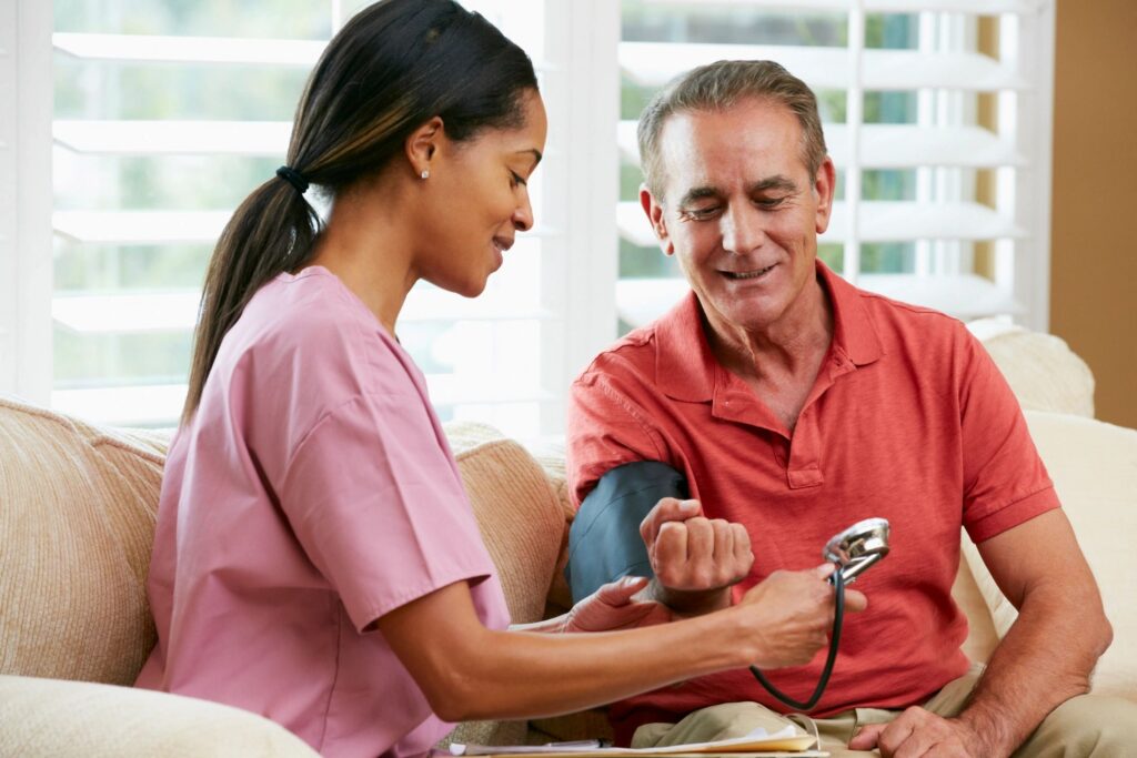 “Caregiver assisting an older adult at home in Philadelphia.” private caregiver vs home care agency